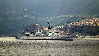Decommissioned Audace transiting the Messina Strait by tug to Aliaga to be demolished and scrapped on 8 May 2018