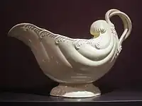 1770s sauceboat, attributed to Leeds; the twisted handle is characteristic.