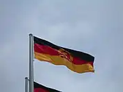 National flag of the German Democratic Republic flying