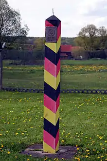 One of the distinctive East German "barber pole" border markers. The spike on the top deterred birds from using it as a perch.