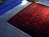 A Turkmen rug in a household setting