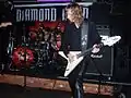 Brian Tatler of Diamond Head shown in 2008 playing an ivory Flying V