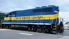A Dakota, Minnesota and Eastern Railroad GP40 running long hood forward