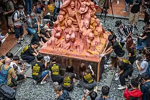 Students preparing the Pillar of Shame for the 32nd anniversary at the University of Hong Kong