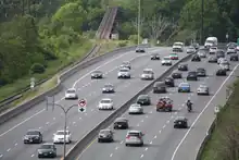 A photograph of a freeway curving and rolling with the landscape.