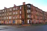 Victorian sandstone tenements in Ardenlea Street that were originally renovated as part of the GEAR (Glasgow Eastern Area Renewal) scheme in the late 1970s, but had their residents systematically rehoused, which led them to fall into a dilapidated state once more. They were totally demolished as part of the 2014 Commonwealth Games Athletes' Village masterplan by RMJM.