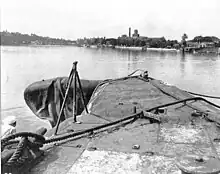 Damaged USS Growler  at the submarine base at New Farm in February 1943