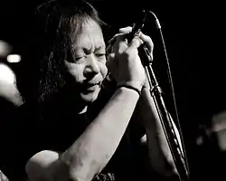 Suzuki performing in 2012