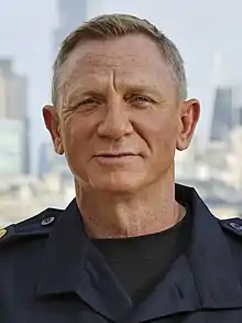 A picture of Daniel Craig smiling towards the camera