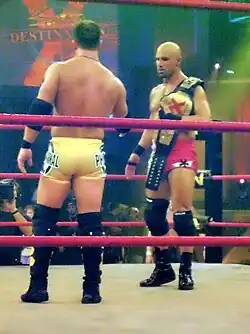 Christopher Daniels with the original design of the X-Division Championship belt.