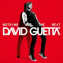In a red background, David Guetta leans against a wall, with a shadow seen behind him.