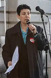 Kotulski speaking into a microphone