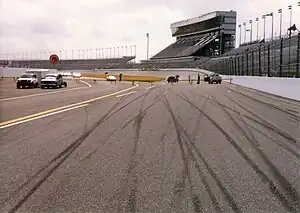 Racetrack skidmarks and view of old grandstand