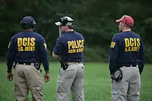 DCIS special agents participate in firearms training at FLETC.