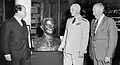 Sculptor Felix de Weldon (left) presents his bust of Admiral of the Fleet Chester W. Nimitz to the Naval War College on 5 June 1964. Austin (center) and retired U.S. Marine Corps Lieutenant General Keller E. Rockey (right) look on.