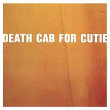 A close-up to a box with the words "Death Cab For Cutie".