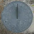 This sundial displays a likeness of Father Time. Its motto quotes Robert Browning: "Grow old along with me; the best is yet to be."