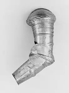 Colour photograph of a left arm from a suit of armour