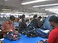 The final steps of preparing jeans for market