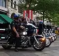 Denver Police patrol the "LoDo" (Lower Downtown) district during the convention