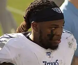 Derrick Henry in a Titans uniform with no helmet.