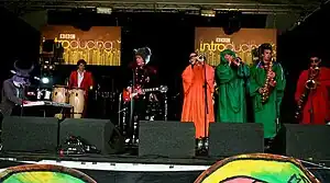 From left to right: Ifan Dafydd, Ifan Jams, Ifan Tomos, Cai Dyfan (rear), Sion Garth, Berwyn Jones, Dafydd Meirion, Morys Williams, performing at the Latitude Festival, 2008