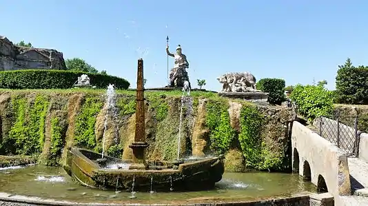 The boat with an obelisk mast, symbolizing the Tiburtina island in the Tiber, below the statue of Rome Triumphant