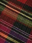 Detail of Serbian tartan folk dress, densely pleated, 2017