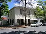 The Devonshire House is situated on the oldest street corner of Stellenbosch and was erected here in about 1861. It is a double-storeyed townhouse in the early Victorian style.