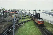 44216 and another haul the northbound Brisbane Limited across the Corinda line at Yeerongpilly in 1987