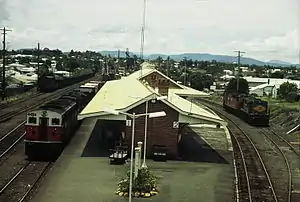 4456 and a 45 class haul a southbound goods train through Casino station, 1987