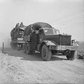 Diamond T tank transporter with a Churchill tank during preparations for crossing the Rhine.