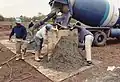 Shaping the concrete boulders.