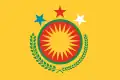 Rojava's former emblem superimposed on a yellow-orangeish background