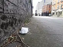 A discarded facemask on a Dublin street in June 2022.