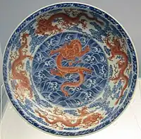 Dish with underglazed blue and overglazed red design of clouds and dragons, Jingdezhen ware, Yongzheng period (1723–1735), Qing dynasty, Shanghai Museum