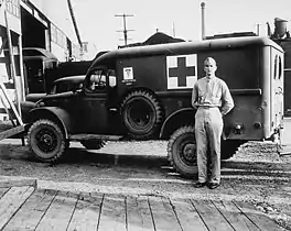 Ambulance at entrance to Pier 5, waiting for debarkation of wounded American soldiers from Tunisia.