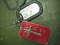 Military ID tag, with a cross on the chain, but with a designation: NO PREF