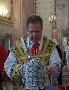 Distribution of Communion at a Tridentine Mass, women typically wear a headcovering.