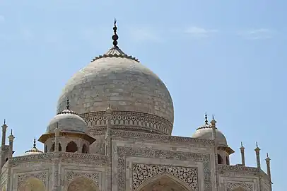 Main marble dome, smaller domes, and decorative spires that extend from the edges of the base walls