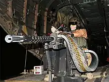 A German Army door gunner mans an M3M on board a CH-53 helicopter.