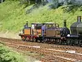 Stepney and Fenchurch on the Bluebell Railway (August 2007) showing the difference in size compared to the larger GWR Dukedog engine just visible to the right, as well as the different styled smokebox on Fenchurch which is closer to the original styling.