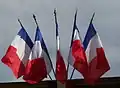Multiple French flags as commonly flown from public buildings