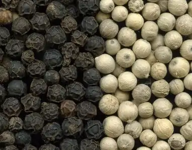 Black peppercorns and white peppercorns