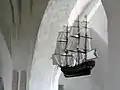 A model ship (probably expressing thanks for help during a storm) hanging in a Söderköping church.