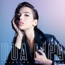 Dua Lipa wearing a scaled jacket, resting her head on her hand with wet hair over a blue-purple background. Her name appears at the bottom in big block letters while the song's title appears under it in small letters.