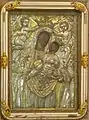 "Our Lady of the Harbor" with a painting of "Madonna and Child", framed by a silver relief