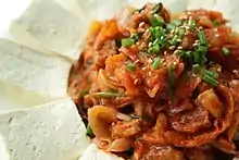 Dubu-kimchi (blanched tofu served with stir-fried kimchi)