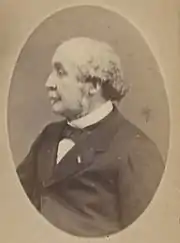 Sepia-toned black and white photograph of Albert de Broglie faced left