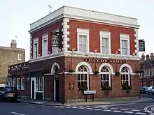  Photograph of a two-storey red brick building with signage indicating it is a pub called the Duchy Arms